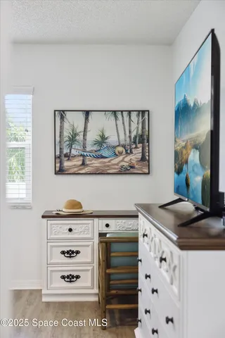 a view of kitchen cabinets and window