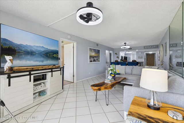 a living room with furniture and a table