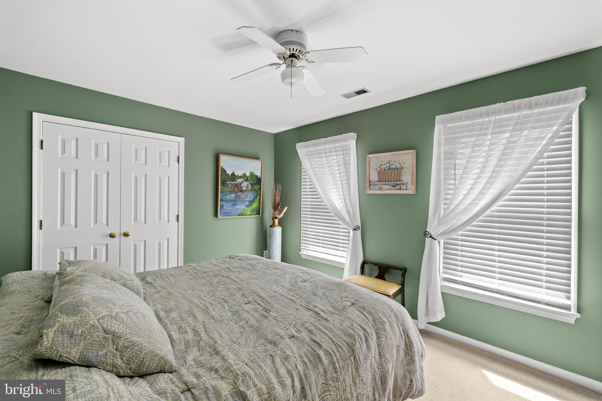 100 Boscobel Road Fredericksburg, VA 22405 - Photo 47 of 67 a bedroom with a bed and a chandelier