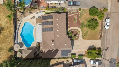 an aerial view of a residential apartment building with a yard