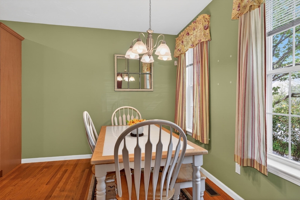 15 Hastings Road, Unit 15 Hudson, MA 01749 - Photo 14 of 40 a view of a dining room with furniture window and wooden floor