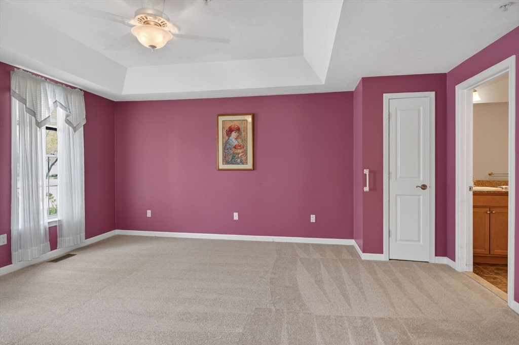 15 Hastings Road, Unit 15 Hudson, MA 01749 - Photo 24 of 40 a view of a livingroom with an empty space and a workspace