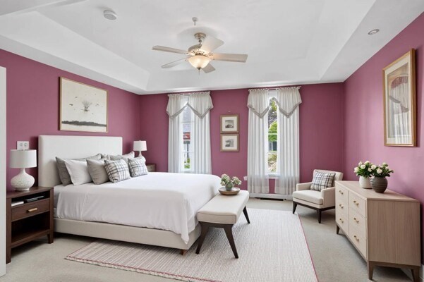 15 Hastings Road, Unit 15 Hudson, MA 01749 - Photo 25 of 40 a bedroom with a bed and a chandelier