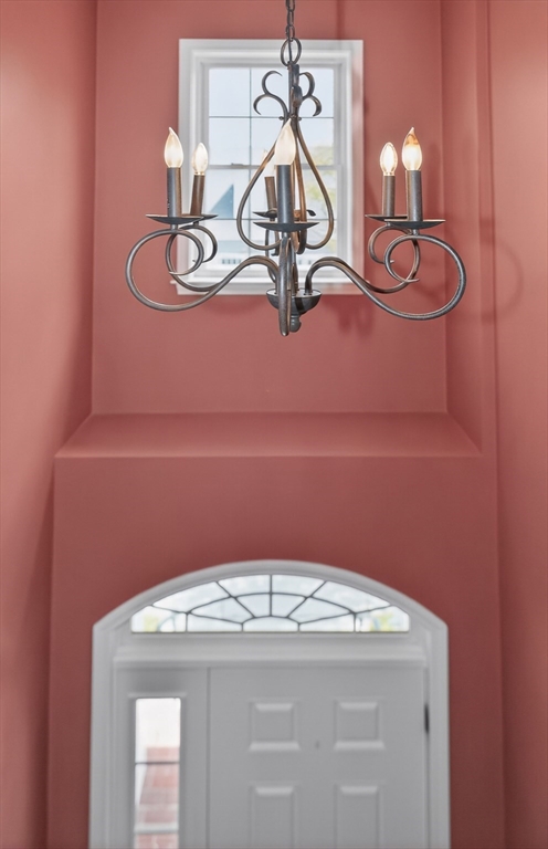 15 Hastings Road, Unit 15 Hudson, MA 01749 - Photo 32 of 40 a room with light fixtures and chandelier