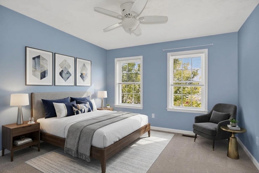 15 Hastings Road, Unit 15 Hudson, MA 01749 - Photo 35 of 40 a bedroom with a bed and a couch