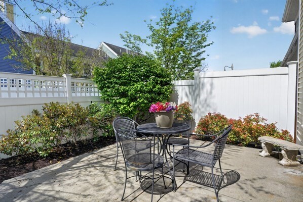 15 Hastings Road, Unit 15 Hudson, MA 01749 - Photo 39 of 40 a view of a chairs and table in backyard