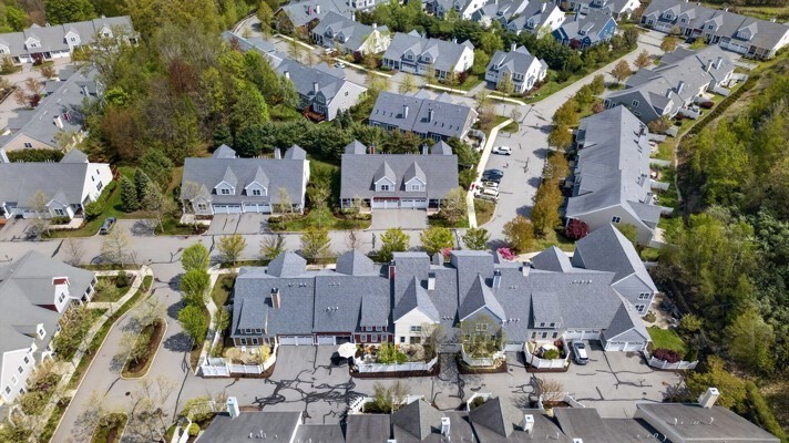 15 Hastings Road, Unit 15 Hudson, MA 01749 - Photo 7 of 40 an aerial view of multiple houses with outdoor space