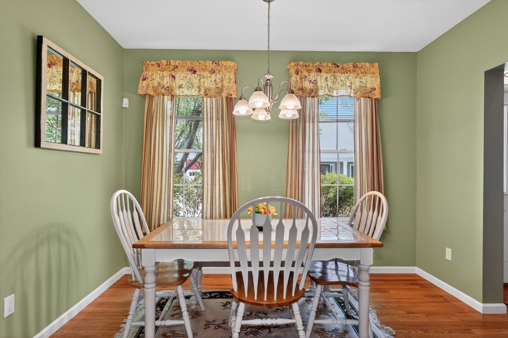 15 Hastings Road, Unit 15 Hudson, MA 01749 - Photo 10 of 40 a view of a dining room with furniture and chandelier