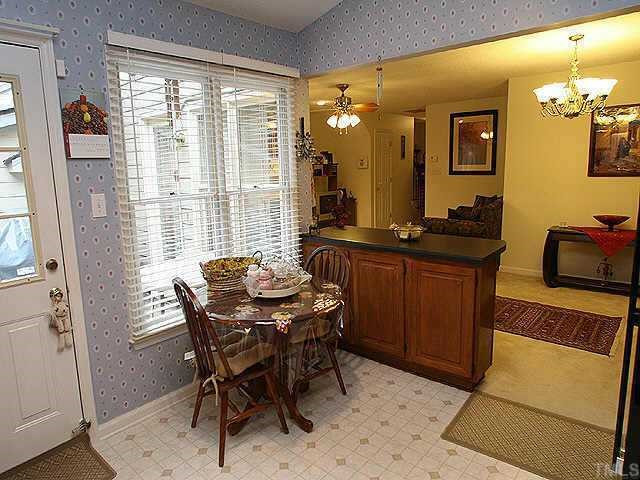 6704 Twin Tree Court Raleigh, NC 27613 - Photo 5 of 11 The vaulted ceiling in the eat-in kitchen makes this room feel even more spacious, there is abundant cabinet space, updated appliances & countertops. Other