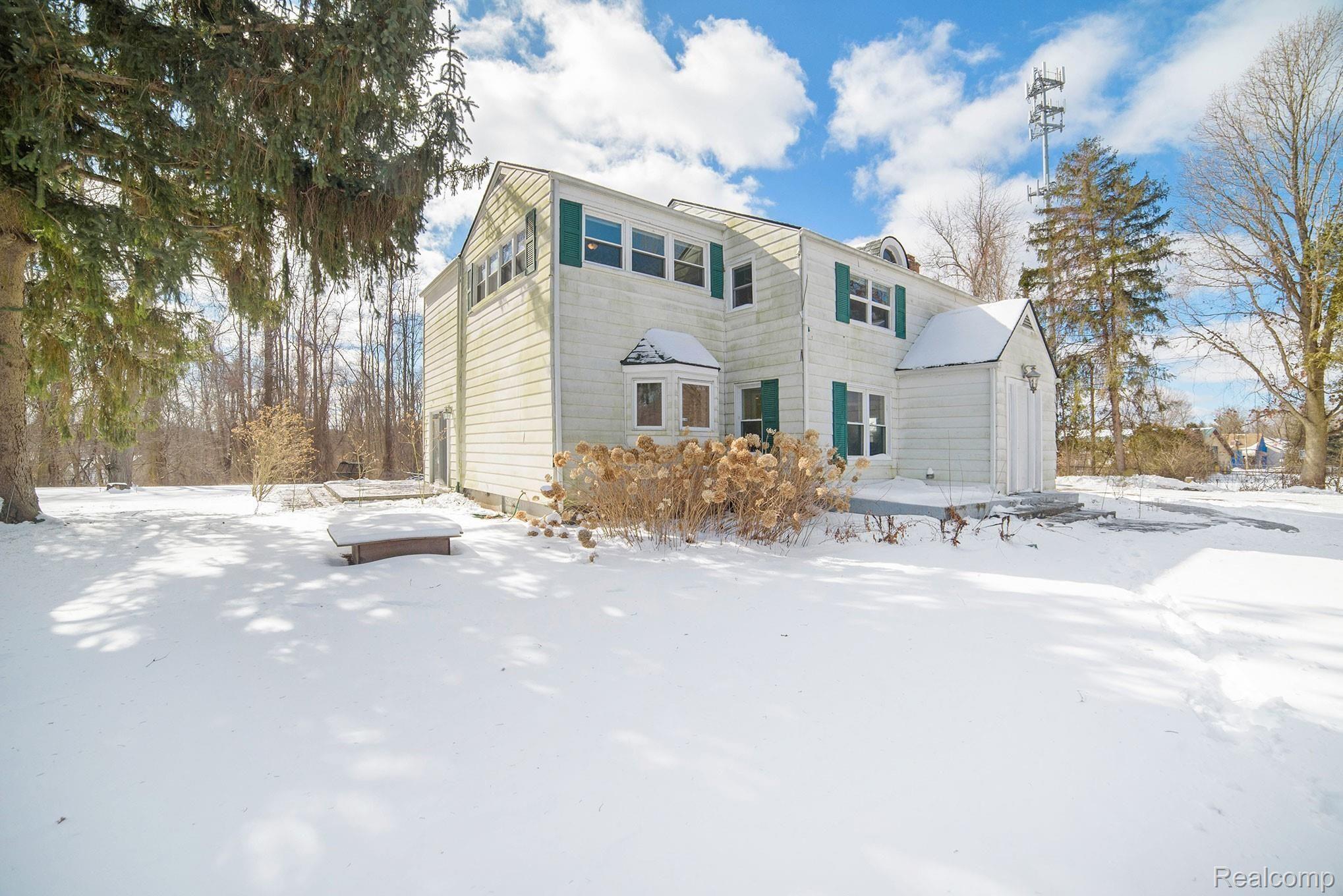 1458 Rochester Road Leonard, MI 48367 - Photo 2 of 32 3/4 view of front exterior, to be power washed, weather permitting