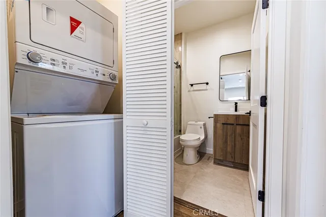 a bathroom with a toilet sink and shower