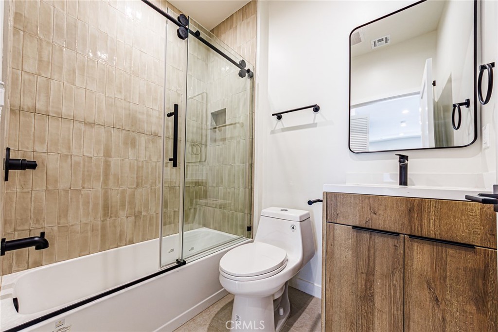 1859 1/2 South Crenshaw Boulevard Los Angeles, CA 90019 - Photo 15 of 29 a bathroom with a toilet sink and shower