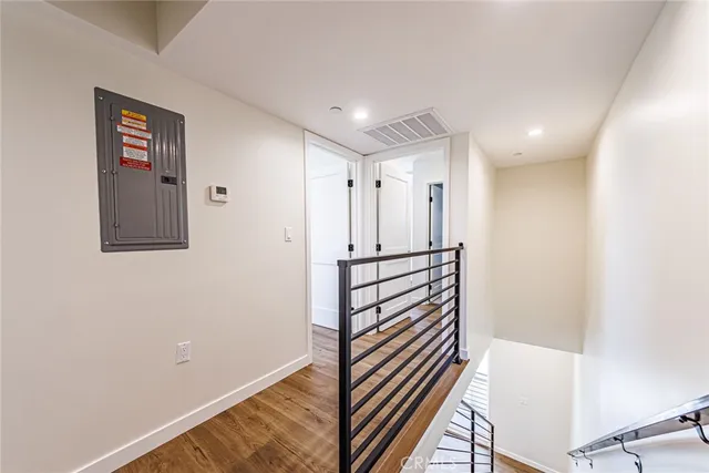 a bathroom with a toilet a sink and glass door