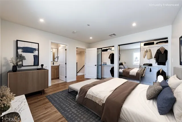 a bedroom with a large bed and a couch