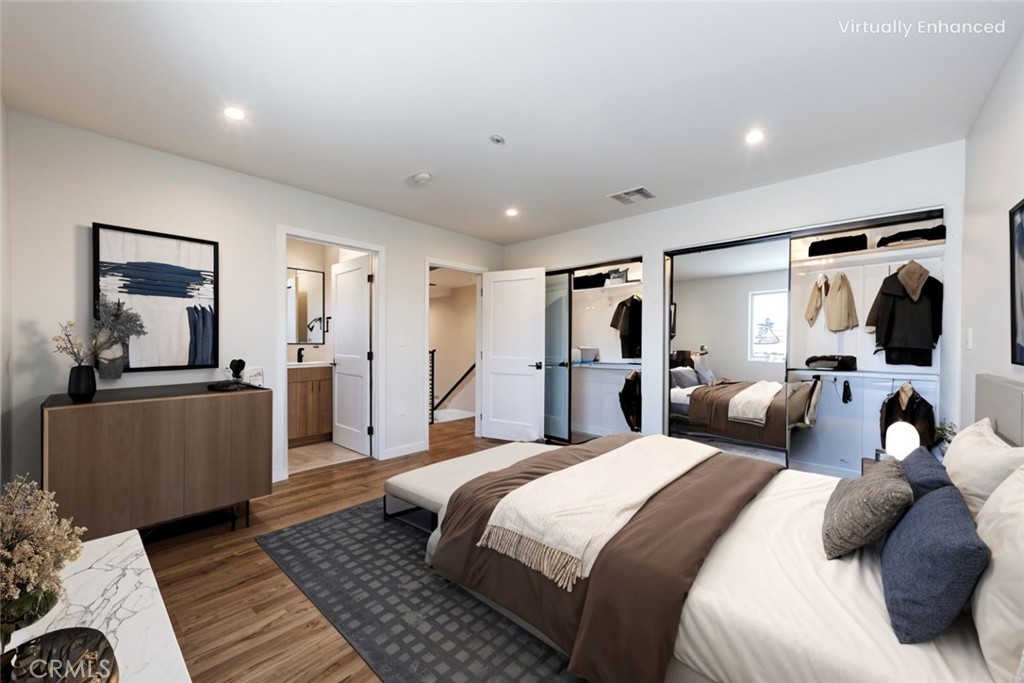 1859 1/2 South Crenshaw Boulevard Los Angeles, CA 90019 - Photo 3 of 29 a bedroom with a large bed and a couch