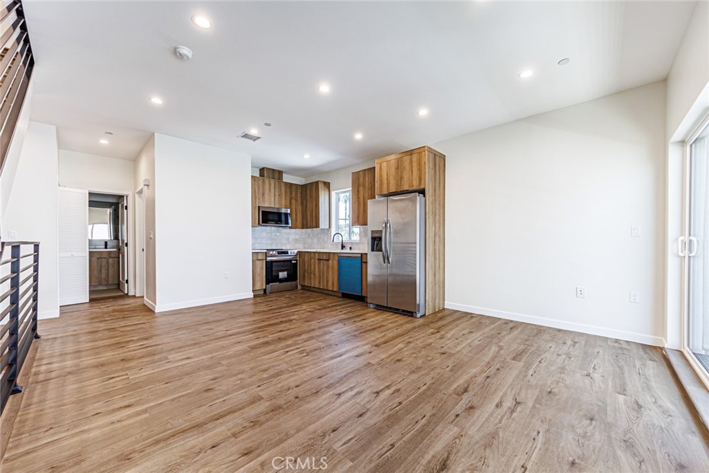 1859 1/2 South Crenshaw Boulevard Los Angeles, CA 90019 - Photo 7 of 29 a view of kitchen with cabinets and wooden floor
