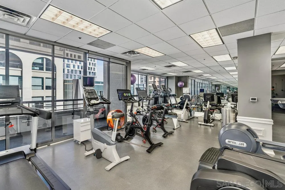 700 Front Street, Unit 2105 San Diego, CA 92101 - Photo 23 of 28 a room with gym equipment and large mirror