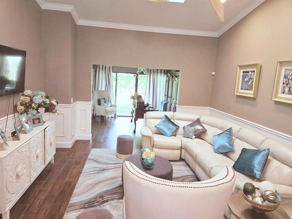 8223 Springlake Drive, Unit 8223 Boca Raton, FL 33496 - Photo 6 of 14 a living room with furniture and a large window