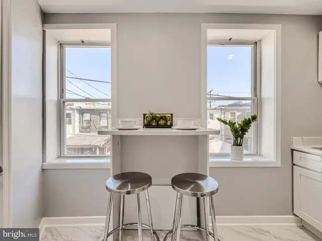 a view of a chair and table in a room