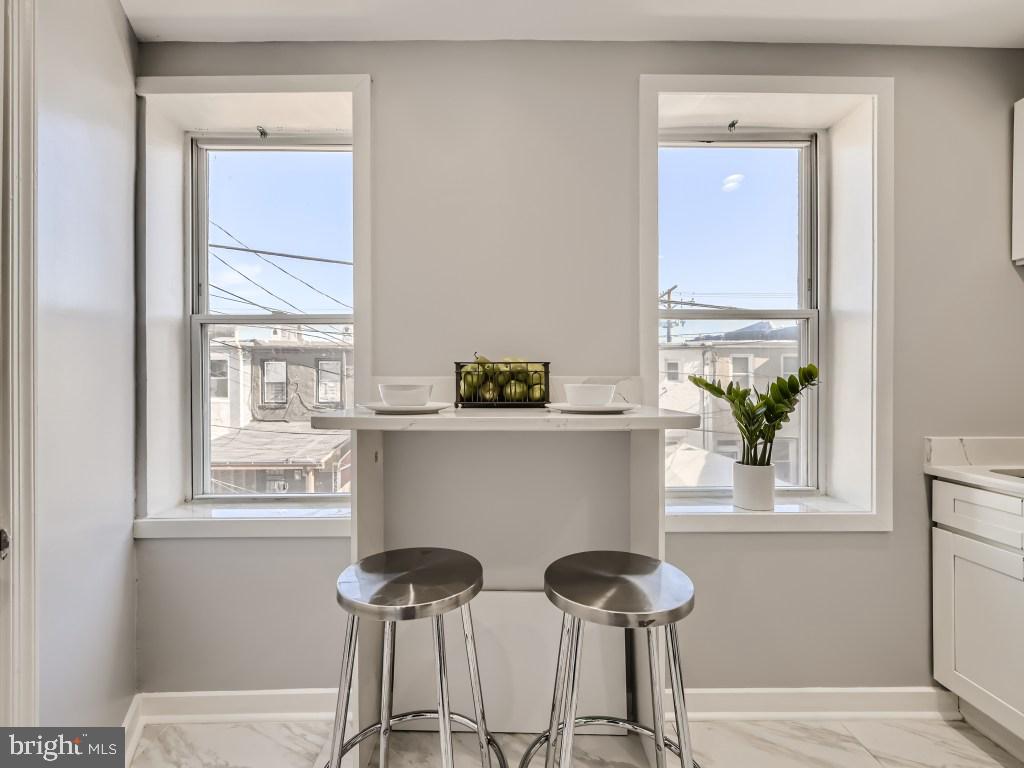 1402 Carroll Street Baltimore, MD 21230 - Photo 12 of 28 a view of a chair and table in a room