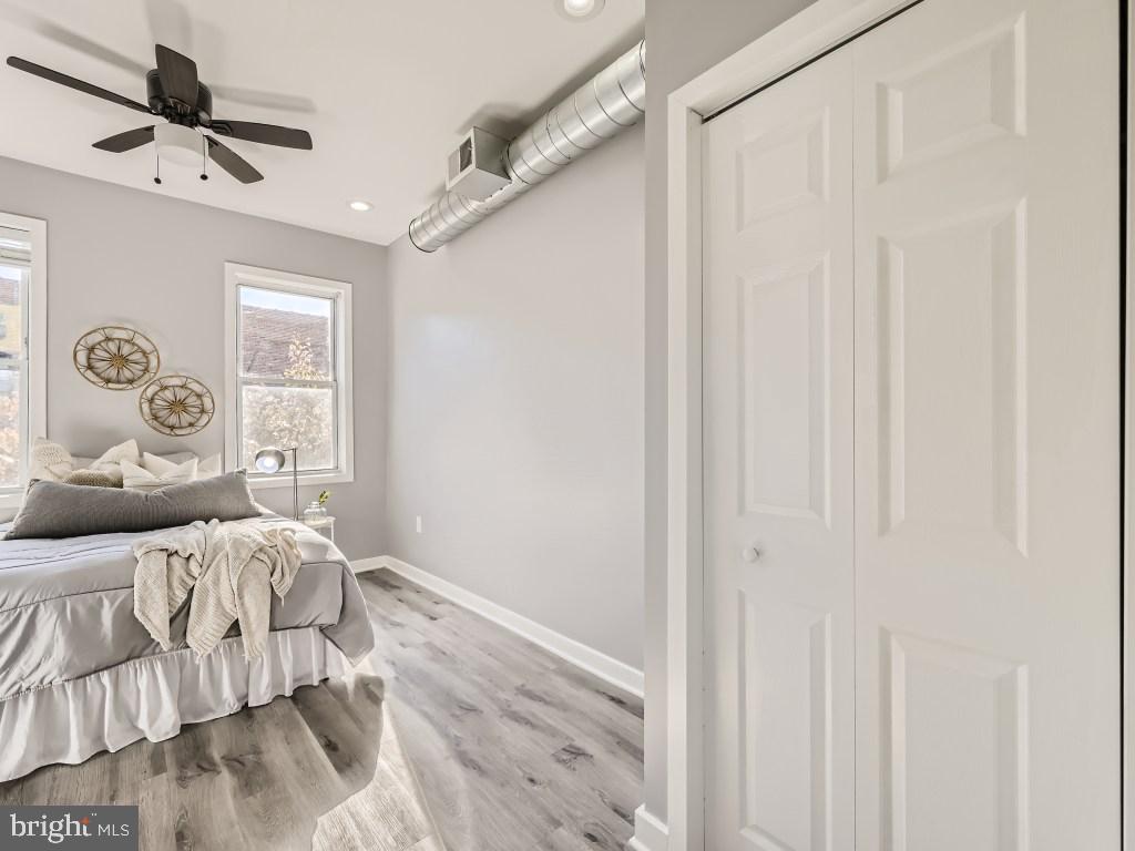 1402 Carroll Street Baltimore, MD 21230 - Photo 14 of 28 a bedroom with a bed and a window