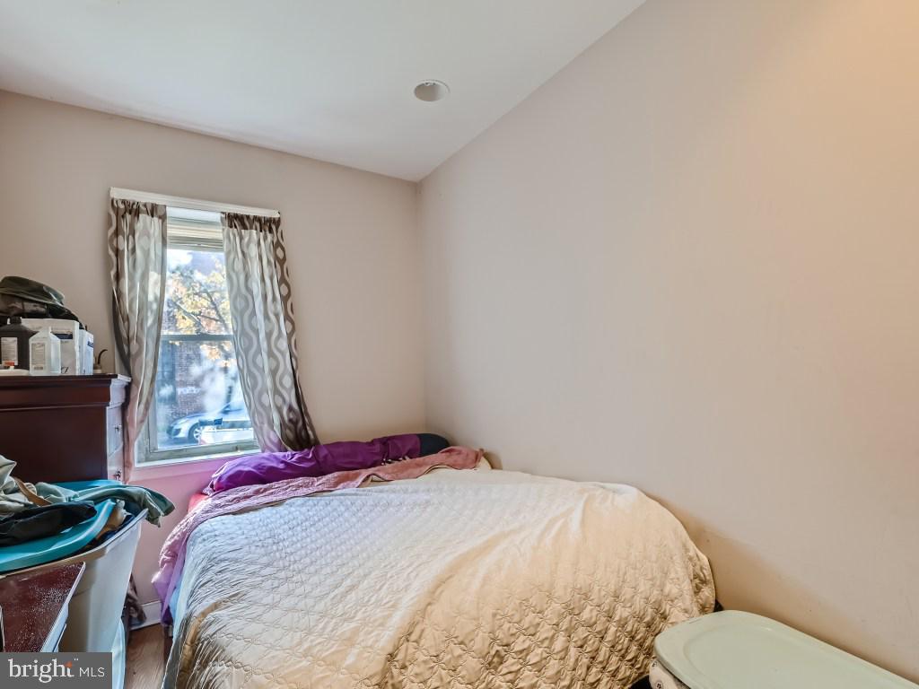 1402 Carroll Street Baltimore, MD 21230 - Photo 22 of 28 a bedroom with a bed and a window
