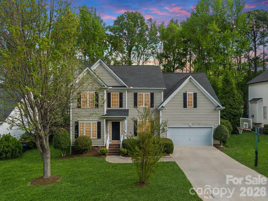 17028 Hampton Trace Road Huntersville, NC 28078 - Photo 1 of 41 a front view of a house with a yard and trees
