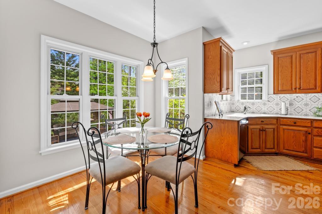 17028 Hampton Trace Road Huntersville, NC 28078 - Photo 11 of 41 a view of a dining room with furniture window and outside view