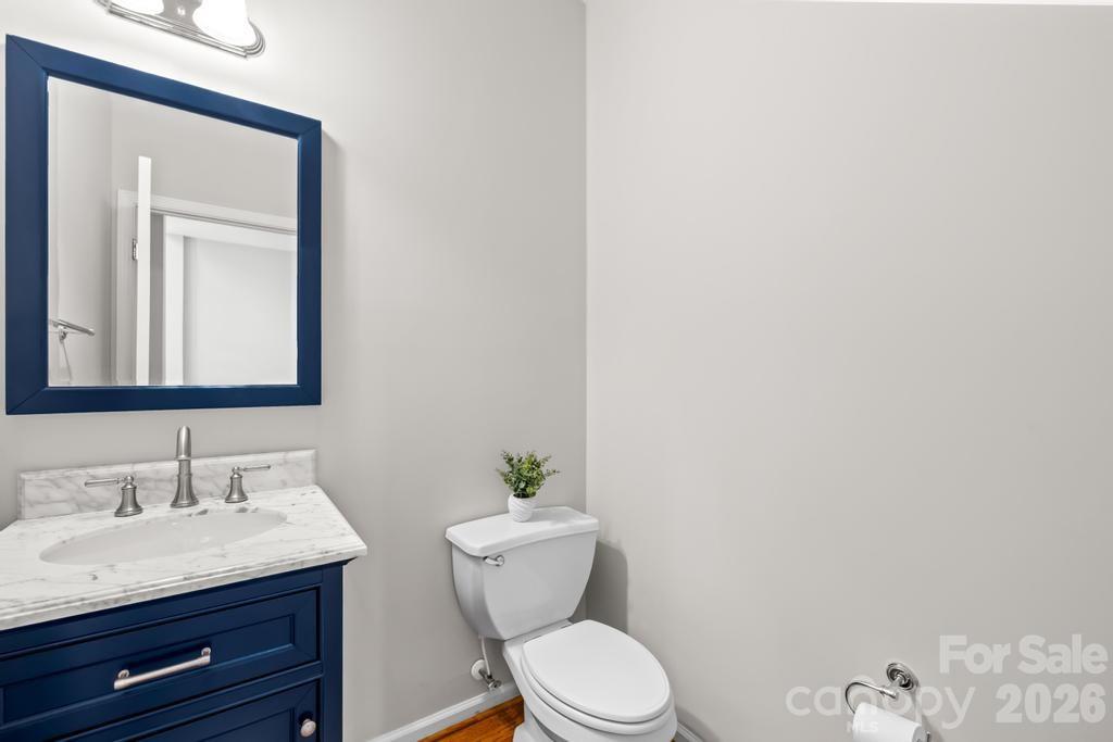 17028 Hampton Trace Road Huntersville, NC 28078 - Photo 16 of 41 a bathroom with a granite countertop toilet sink and mirror
