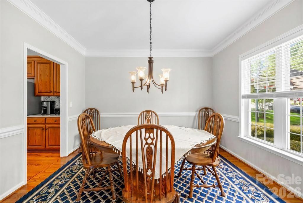 17028 Hampton Trace Road Huntersville, NC 28078 - Photo 18 of 41 a view of a dining room with furniture window and outside view