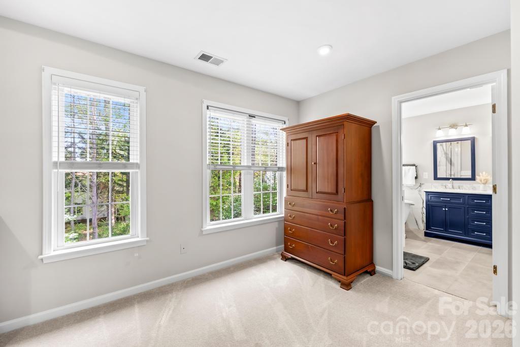 17028 Hampton Trace Road Huntersville, NC 28078 - Photo 22 of 41 an empty room with windows and cabinet