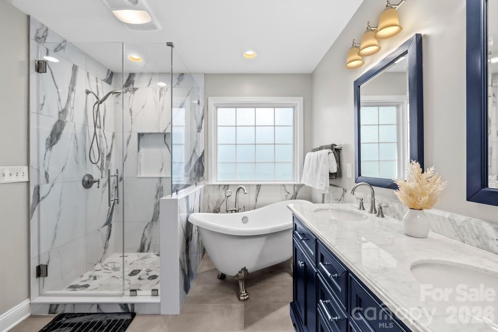 17028 Hampton Trace Road Huntersville, NC 28078 - Photo 24 of 41 a spacious bathroom with a tub sink and mirror