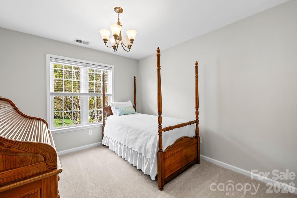 17028 Hampton Trace Road Huntersville, NC 28078 - Photo 26 of 41 a bed room with a bed and a window
