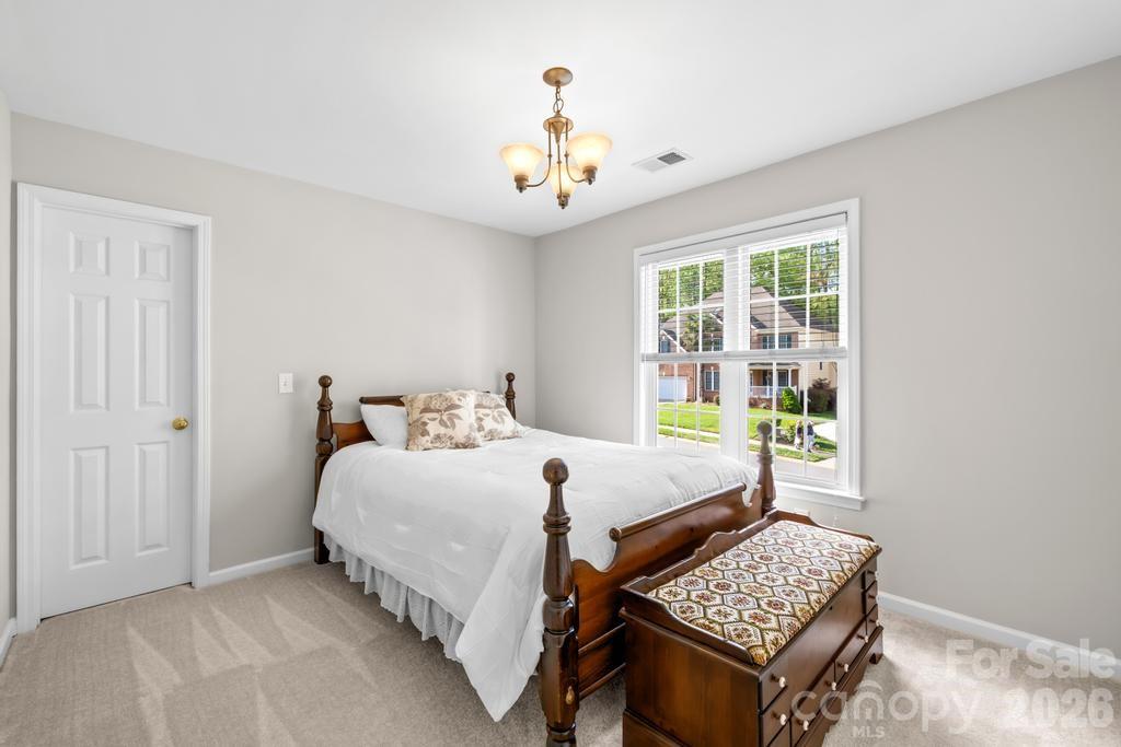 17028 Hampton Trace Road Huntersville, NC 28078 - Photo 27 of 41 a bedroom with bed and a window
