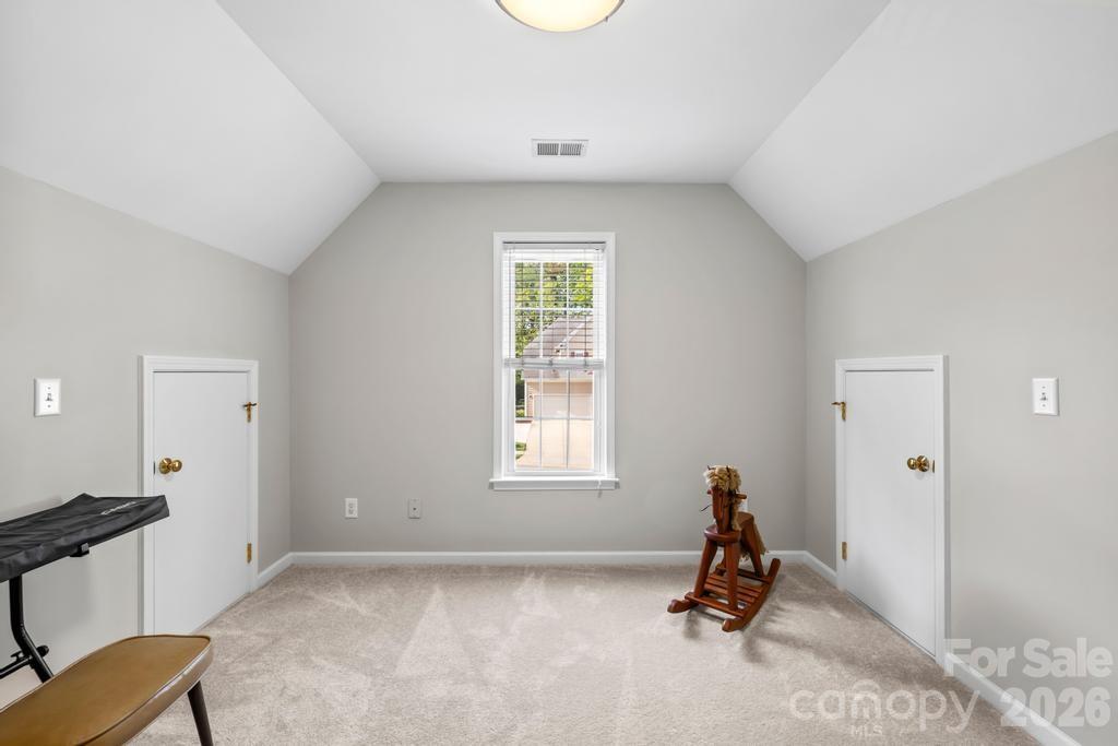 17028 Hampton Trace Road Huntersville, NC 28078 - Photo 31 of 41 a view of a room with gym equipment and a window