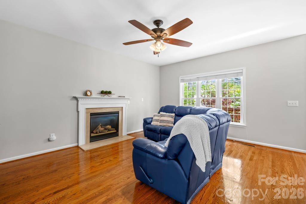 17028 Hampton Trace Road Huntersville, NC 28078 - Photo 6 of 41 a living room with furniture and a fireplace
