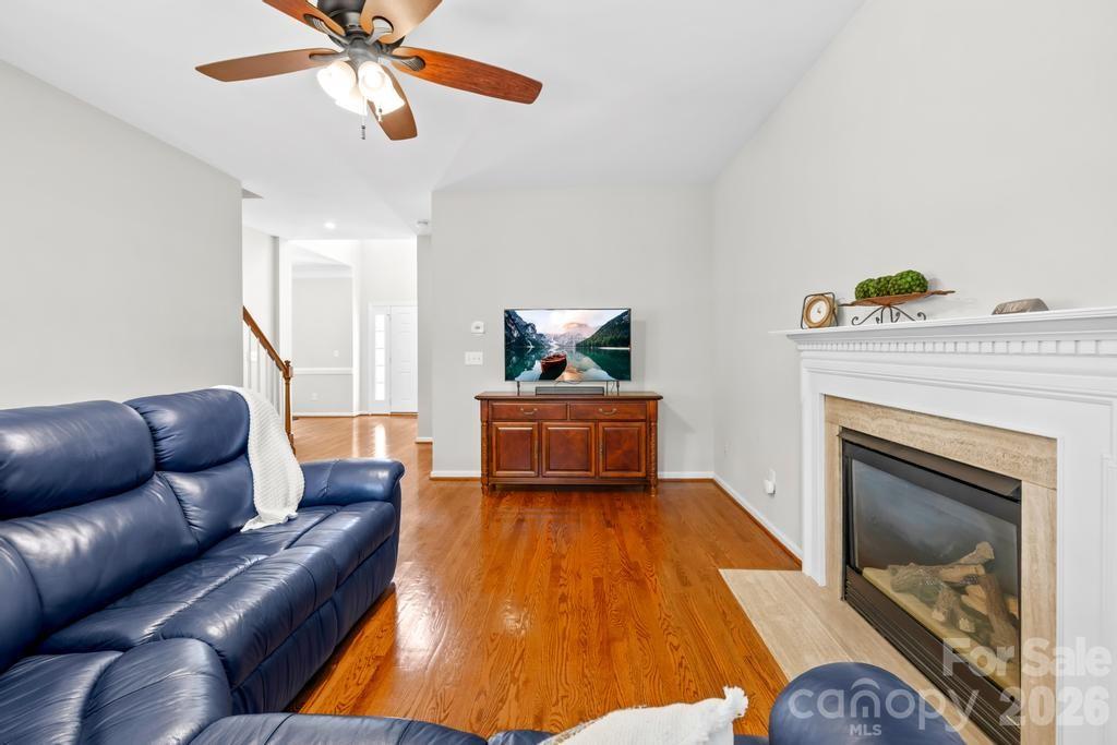 17028 Hampton Trace Road Huntersville, NC 28078 - Photo 9 of 41 a living room with furniture and a fireplace