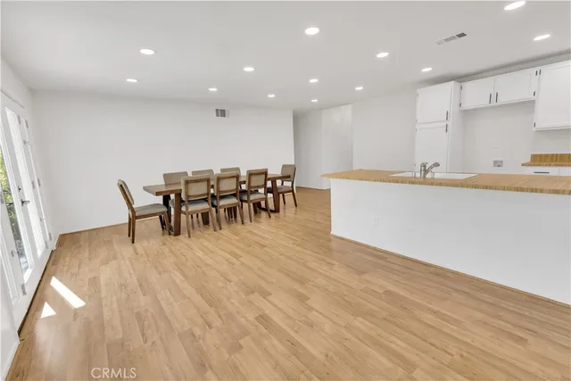 a kitchen with a table and chairs in it