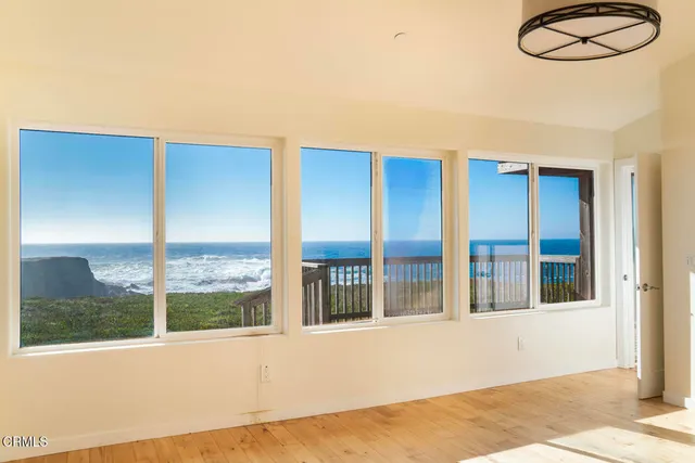 a bathroom with a granite countertop sink and a bathtub