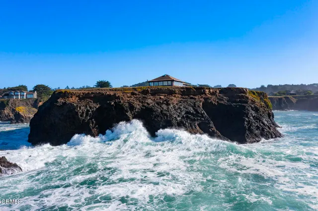 a view of terrace with lawn chairs