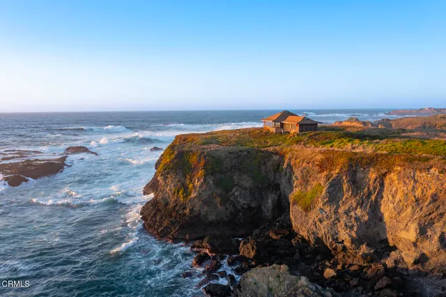 an aerial view of residential building and mountain view