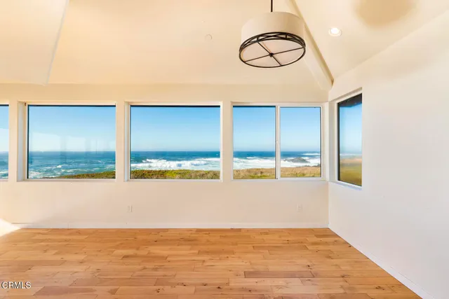 a view of a kitchen with kitchen island a sink and a window