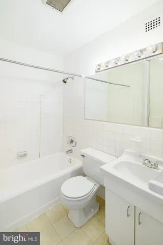 a bathroom with a toilet a sink and a bathtub