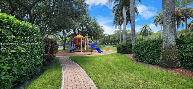 a view of a park with palm trees