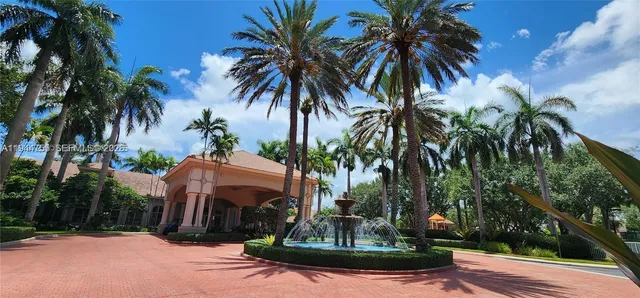 a view of a yard with palm trees