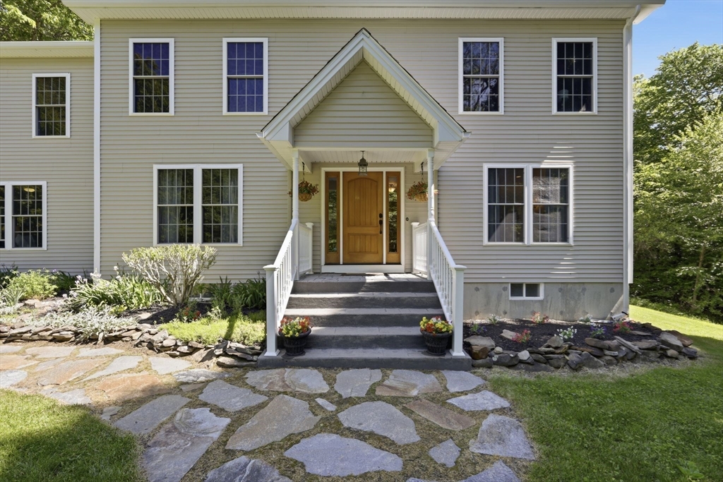 345 Bragg Road Warren, MA 01585 - Photo 3 of 41 front view of a house with a yard