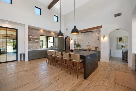 a living room with fireplace furniture and a flat screen tv