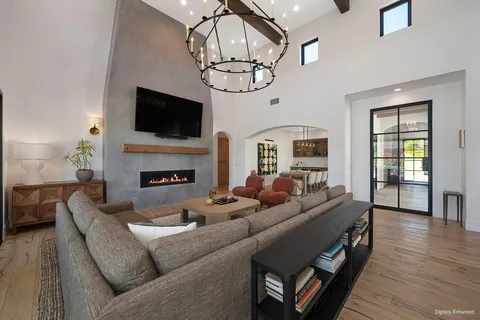a living room with furniture fireplace and flat screen tv