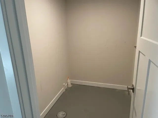 a view of kitchen with wooden cabinet