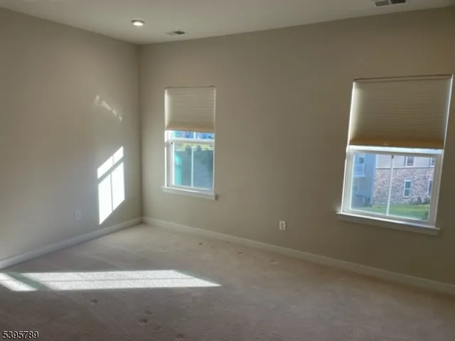 a bathroom with a tub a sink and mirror